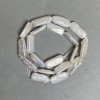 Contas de pérolas barrocas no fio com reflexo «petróleo» tom quente, diâmetro 10x21mm, comprimento 41cm (+-)