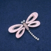 Broche Libélula com madrepérola rosada, néon rosé e strass cinza, metal prateado 62x45mm +