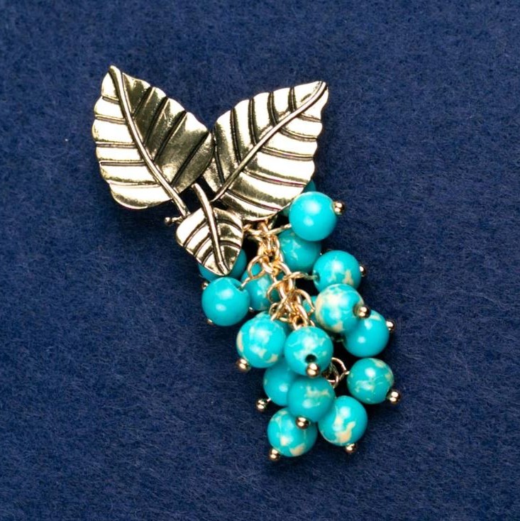 Broche com Variscita "Ramo com frutos", cor dourada do metal 60x35mm
